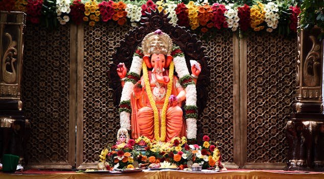 Vibrant Ganesh idol decorated with flowers at a Bengaluru festival.